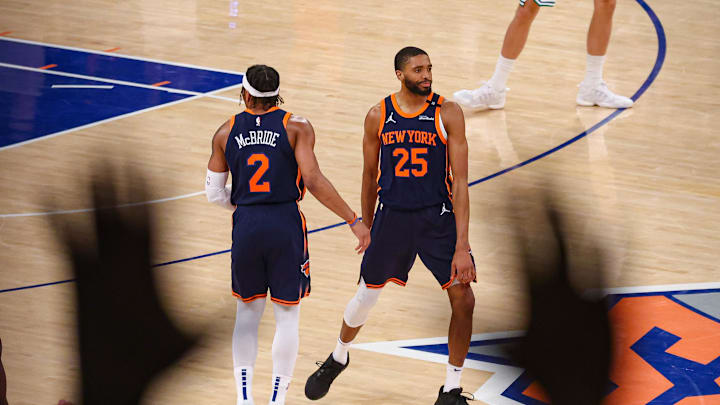 May 12, 2025; New York, New York, USA; New York Knicks forward Mikal Bridges (25) and guard Miles McBride (2) celebrates after a basket in the second half during game four of the second round for the 2025 NBA Playoffs against the Boston Celtics at Madison Square Garden. Mandatory Credit: Vincent Carchietta-Imagn Images