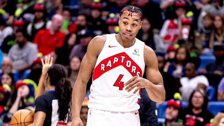 Nov 27, 2024; New Orleans, Louisiana, USA;  Toronto Raptors forward Scottie Barnes (4) reacts to being struck in the face on a play by the New Orleans Pelicans during the first half at Smoothie King Center. Mandatory Credit: Stephen Lew-Imagn Images
