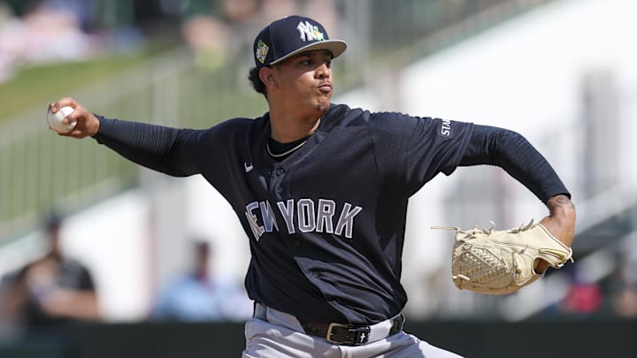 Feb 27, 2026; Fort Myers, Florida, USA; New York Yankees pitcher Carlos Lagrange (84) throws a pitch against the Minnesota Twins in the fourth inning during spring training at Lee Health Sports Complex/Hammond Stadium. Mandatory Credit: Nathan Ray Seebeck-Imagn Images
