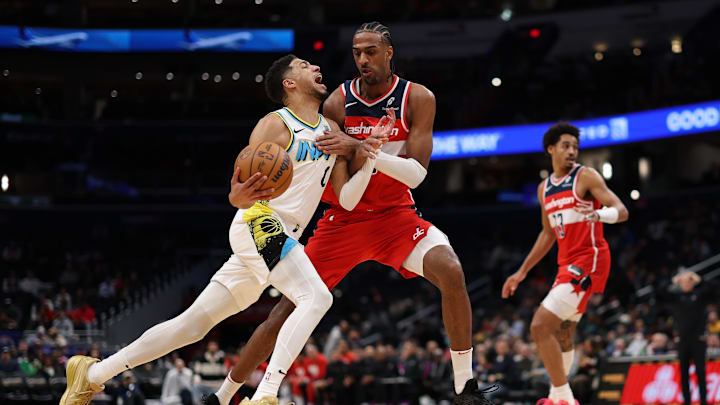 Feb 12, 2025; Washington, District of Columbia, USA; Indiana Pacers guard Tyrese Haliburton (0) drives to the basket as Washington Wizards forward Alex Sarr (20) defends in the third quarter at Capital One Arena. Mandatory Credit: Geoff Burke-Imagn Images