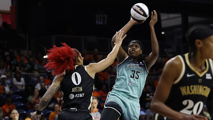 Jun 5, 2025; Washington, District of Columbia, USA; New York Liberty center Jonquel Jones (35) shoots the ball over Washington Mystics forward Shakira Austin (0) in the first half at Entertainment & Sports Arena. Mandatory Credit: Geoff Burke-Imagn Images
