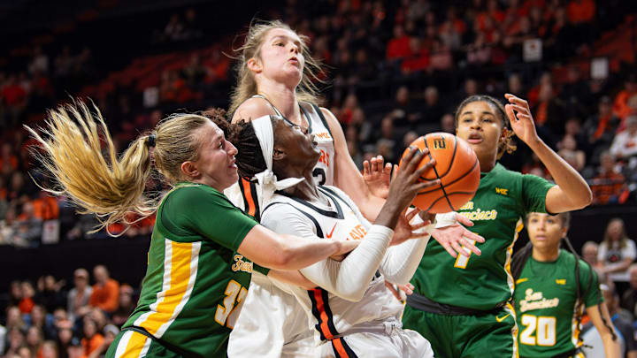 San Francisco's Cami Fulcher (32), left, fouls Oregon State's Catarina Ferreira (30) during an NCAA basketball game at Gill Coliseum on Thursday, Jan. 9, 2025, in Corvallis, Ore. San Francisco's Cami Fulcher (32), left, fouls Oregon State's Catarina Ferreira (30) during an NCAA basketball game at Gill Coliseum on Thursday, Jan. 9, 2025, in Corvallis, Ore.