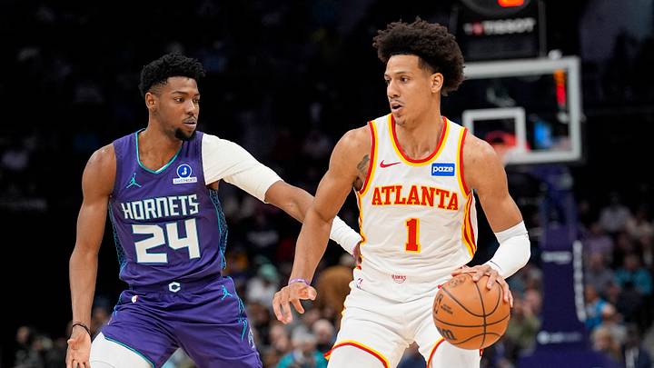 Feb 11, 2026; Charlotte, North Carolina, USA; Atlanta Hawks forward Jalen Johnson (1) handles the ball defended by Charlotte Hornets forward Brandon Miller (24) during first quarter at Spectrum Center. Mandatory Credit: Jim Dedmon-Imagn Images Feb 11, 2026; Charlotte, North Carolina, USA; Atlanta Hawks forward Jalen Johnson (1) handles the ball defended by Charlotte Hornets forward Brandon Miller (24) during first quarter at Spectrum Center. Mandatory Credit: Jim Dedmon-Imagn Images