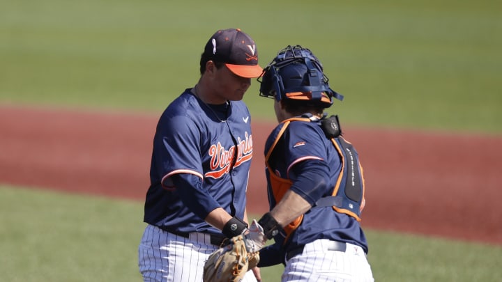 Owen Coady talks to Jacob Ference during the Virginia baseball game at Boston College.