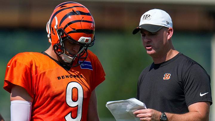 Cincinnati Bengals quarterback Joe Burrow (9) talks with head coach Zac Taylor during a preseason training camp practice in downtown Cincinnati on Wednesday, July 30, 2025. Cincinnati Bengals quarterback Joe Burrow (9) talks with head coach Zac Taylor during a preseason training camp practice in downtown Cincinnati on Wednesday, July 30, 2025.