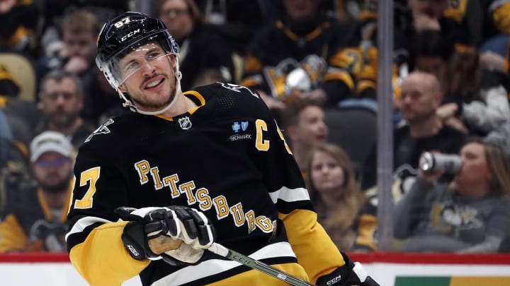 Mar 28, 2024; Pittsburgh, Pennsylvania, USA;  Pittsburgh Penguins center Sidney Crosby (87) reacts on the ice against the Columbus Blue Jackets during the third period at PPG Paints Arena. The Penguins won 3-2. Mandatory Credit: Charles LeClaire-USA TODAY Sports