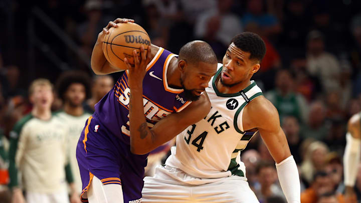 Mar 24, 2025; Phoenix, Arizona, USA; Milwaukee Bucks forward Giannis Antetokounmpo (34) defends against Phoenix Suns forward Kevin Durant (35) at Footprint Center. Mandatory Credit: Mark J. Rebilas-Imagn Images Mar 24, 2025; Phoenix, Arizona, USA; Milwaukee Bucks forward Giannis Antetokounmpo (34) defends against Phoenix Suns forward Kevin Durant (35) at Footprint Center. Mandatory Credit: Mark J. Rebilas-Imagn Images