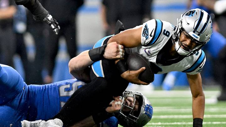 Oct 8, 2023; Detroit, Michigan, USA; Carolina Panthers quarterback Bryce Young (9) gets sacked by Detroit Lions defensive end Aidan Hutchinson (97) in the third quarter at Ford Field. Mandatory Credit: Lon Horwedel-USA TODAY Sports
