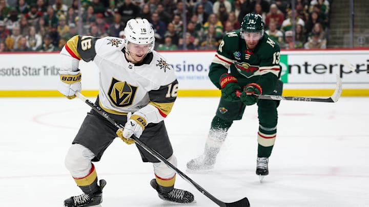 Mar 25, 2025; Saint Paul, Minnesota, USA; Vegas Golden Knights left wing Pavel Dorofeyev (16) skates with the puck as Minnesota Wild center Yakov Trenin (13) defends during the second period at Xcel Energy Center. Mandatory Credit: Matt Krohn-Imagn Images