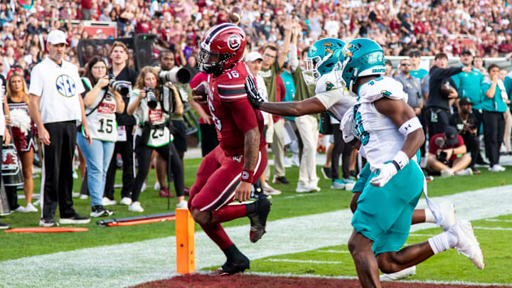 Nov 22, 2025; Columbia, South Carolina, USA; South Carolina Gamecocks quarterback Lanorris Sellers (16) scores a touchdown against the Coastal Carolina Chanticleers in the first quarter at Williams-Brice Stadium. Mandatory Credit: Jeff Blake-Imagn Images Nov 22, 2025; Columbia, South Carolina, USA; South Carolina Gamecocks quarterback Lanorris Sellers (16) scores a touchdown against the Coastal Carolina Chanticleers in the first quarter at Williams-Brice Stadium. Mandatory Credit: Jeff Blake-Imagn Images