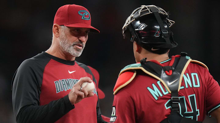 Arizona Diamondbacks manager Torey Lovullo talks to catcher Gabriel Moreno (14) during their game against the Seattle Mariners at Chase Field in Phoenix, on June 10, 2025.