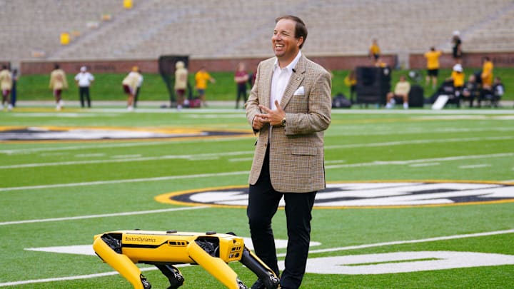 Sep 14, 2024; Columbia, Missouri, USA; Missouri Tigers head coach Eli Drinkwitz is interviewed on field with the College of Engineering’s Boston robotics robot Spot on field prior to a game against the Boston College Eagles at Faurot Field at Memorial Stadium.