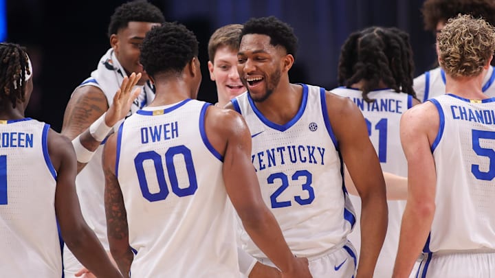 Dec 20, 2025; Atlanta, Georgia, USA; Kentucky Wildcats guard Otega Oweh (00) reacts with forward Mouhamed Dioubate (23) during a timeout against the St. John Red Storm in the second half at State Farm Arena. Mandatory Credit: Brett Davis-Imagn Images
Dec 20, 2025; Atlanta, Georgia, USA; Kentucky Wildcats guard Otega Oweh (00) reacts with forward Mouhamed Dioubate (23) during a timeout against the St. John Red Storm in the second half at State Farm Arena. Mandatory Credit: Brett Davis-Imagn Images