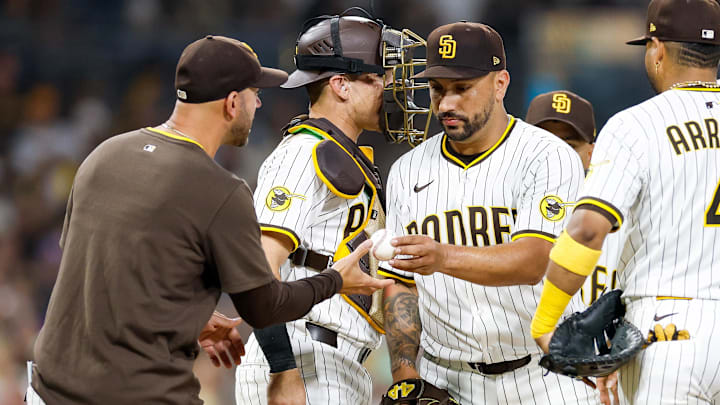 San Diego Padres bench coach Brian Esposito (82) makes a pitching change during the sixth inning against the San Francisco Giants at Petco Park Aug. 18. San Diego Padres bench coach Brian Esposito (82) makes a pitching change during the sixth inning against the San Francisco Giants at Petco Park Aug. 18.