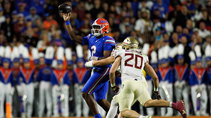 Nov 29, 2025; Gainesville, Florida, USA; Florida Gators quarterback DJ Lagway (2) throws the ball under pressure from Florida State Seminoles defensive lineman James Williams (10) and Florida State Seminoles linebacker Blake Nichelson (20) during the first half at Ben Hill Griffin Stadium. Mandatory Credit: Matt Pendleton-Imagn Images