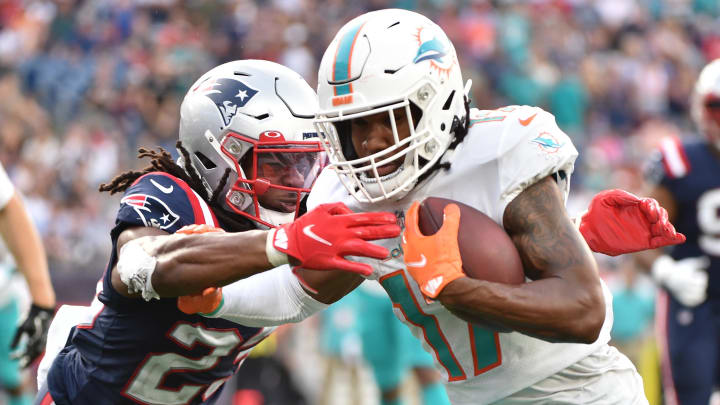 Wide receiver Jaylen Waddle scores a touchdown against the New England Patriots in the 2021 opener at Gillette Stadium.