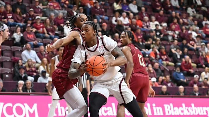 Mar 3, 2026; Blacksburg, Va.; Virginia Tech forward Tobi Lawal (1) makes a move toward the basket as Boston College forward Jayden Hastings (22) defends.