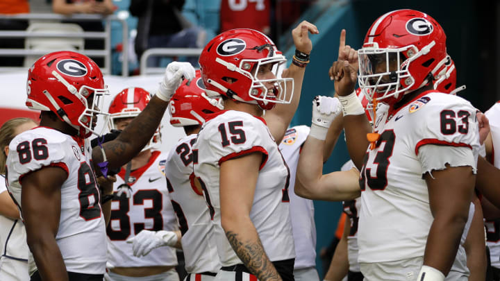 Dec 30, 2023; Miami Gardens, FL, USA; Georgia Bulldogs quarterback Carson Beck (15) leads the team onto the field before the game against the Florida State Seminoles for the 2023 Orange Bowl at Hard Rock Stadium. Mandatory Credit: Sam Navarro-USA TODAY Sports Dec 30, 2023; Miami Gardens, FL, USA; Georgia Bulldogs quarterback Carson Beck (15) leads the team onto the field before the game against the Florida State Seminoles for the 2023 Orange Bowl at Hard Rock Stadium. Mandatory Credit: Sam Navarro-USA TODAY Sports