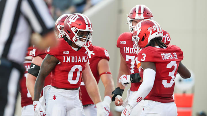 Sep 12, 2025; Bloomington, Indiana, USA; Indiana Hoosiers wide receiver Jonathan Brady (0) and Indiana Hoosiers wide receiver Omar Cooper Jr. (3) celebrate after a touchdown during the first half against the Indiana State Sycamores at Memorial Stadium. Mandatory Credit: Robert Goddin-Imagn Images