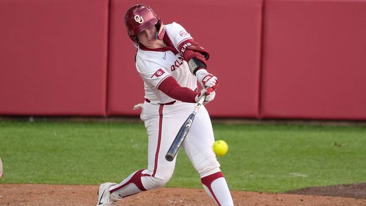 Oklahoma Sooners catcher Kendall Wells (1) drives in a run in the sixth inning of a college softball game between the Oklahoma Sooners and the Arkansas Razorbacks at Love's Field in Norman, Okla., Friday, April 17, 2026. Oklahoma Sooners catcher Kendall Wells (1) drives in a run in the sixth inning of a college softball game between the Oklahoma Sooners and the Arkansas Razorbacks at Love's Field in Norman, Okla., Friday, April 17, 2026.