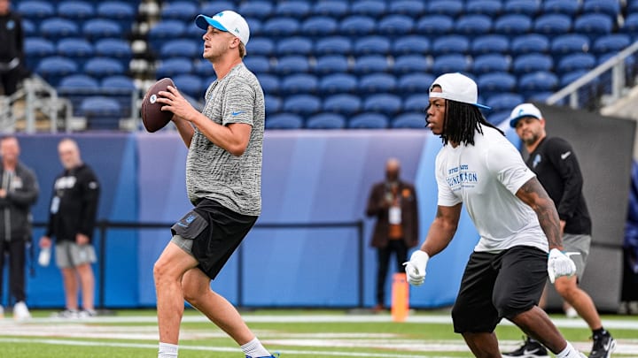 Detroit Lions quarterback Jared Goff (16) and running back Jahmyr Gibbs (0) warm up ahead of the Hall of Fame Game at Tom Benson Hall of Fame Stadium in Canton, Ohio on Thursday, July 31, 2025.
