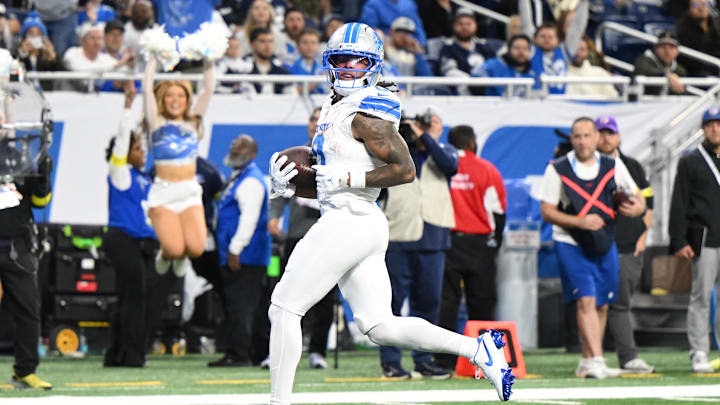 Dec 4, 2025; Detroit, Michigan, USA; Detroit Lions running back Jahmyr Gibbs (0) scores a touchdown during the second half against the Dallas Cowboys at Ford Field. Mandatory Credit: Lon Horwedel-Imagn Images Dec 4, 2025; Detroit, Michigan, USA; Detroit Lions running back Jahmyr Gibbs (0) scores a touchdown during the second half against the Dallas Cowboys at Ford Field. Mandatory Credit: Lon Horwedel-Imagn Images