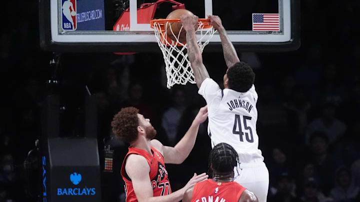 Oct 18, 2024; Brooklyn, New York, USA; Brooklyn Nets guard Keon Johnson (45) dunks the ball against Toronto Raptors forward Jamison Battle (77) during the second half at Barclays Center. Mandatory Credit: Gregory Fisher-Imagn Images Oct 18, 2024; Brooklyn, New York, USA; Brooklyn Nets guard Keon Johnson (45) dunks the ball against Toronto Raptors forward Jamison Battle (77) during the second half at Barclays Center. Mandatory Credit: Gregory Fisher-Imagn Images