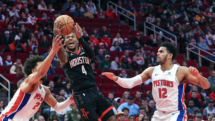Jan 20, 2025; Houston, Texas, USA;  Houston Rockets guard Jalen Green (4) is fouled by Detroit Pistons guard Cade Cunningham (2) in the second quarter at Toyota Center. Mandatory Credit: Thomas Shea-Imagn Images