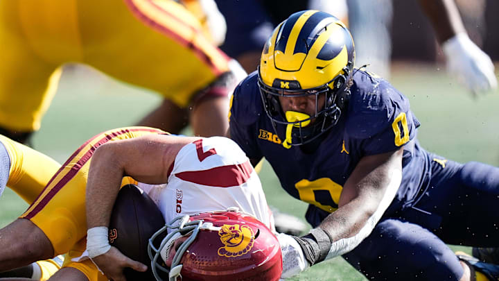 Michigan defensive end Josaiah Stewart (0) sacks USC quarterback Miller Moss (7) during the first half at Michigan Stadium in Ann Arbor on Saturday, Sept. 21, 2024.