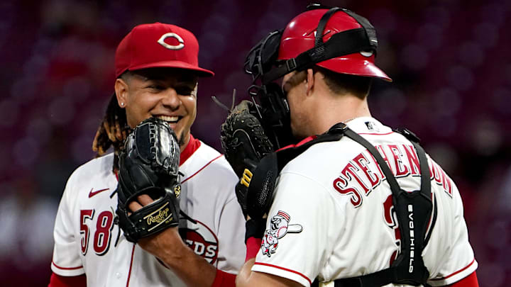 Cincinnati Reds starting pitcher Luis Castillo (58) and Cincinnati Reds catcher Tyler Stephenson laugh.
