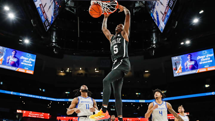 Dec 21, 2024; Memphis, Tennessee, USA; Mississippi State Bulldogs guard Shawn Jones Jr. (5) dunks the ball against the Memphis Tigers during the first half at FedExForum. Mandatory Credit: Wesley Hale-Imagn Images