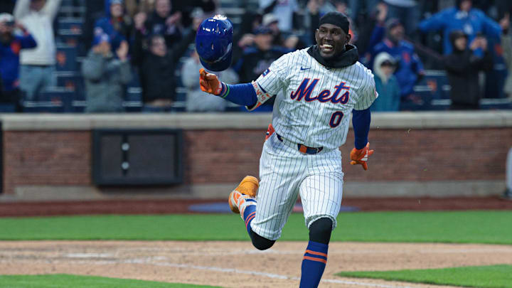 Apr 7, 2026; New York City, New York, USA;  New York Mets pinch hitter Ronny Mauricio (0) celebrates after hitting an RBI walk-off single during the tenth inning against the Arizona Diamondbacks at Citi Field. Mandatory Credit: Vincent Carchietta-Imagn Images