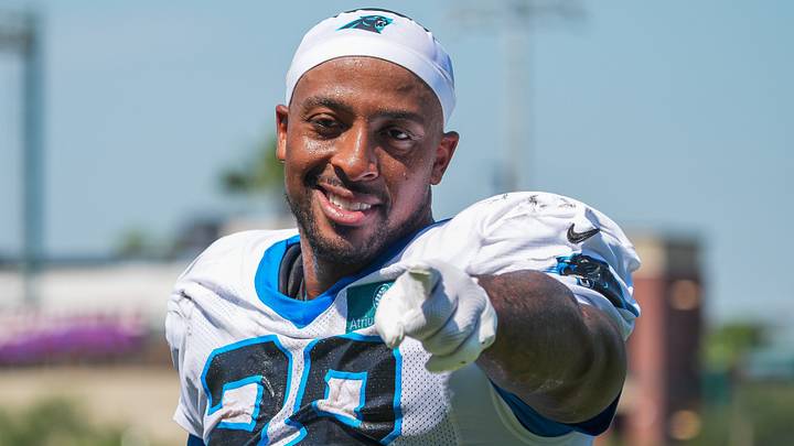 Carolina Panthers running back AJ Dillon (28) points to the photographer while exiting the field after a joint practice 