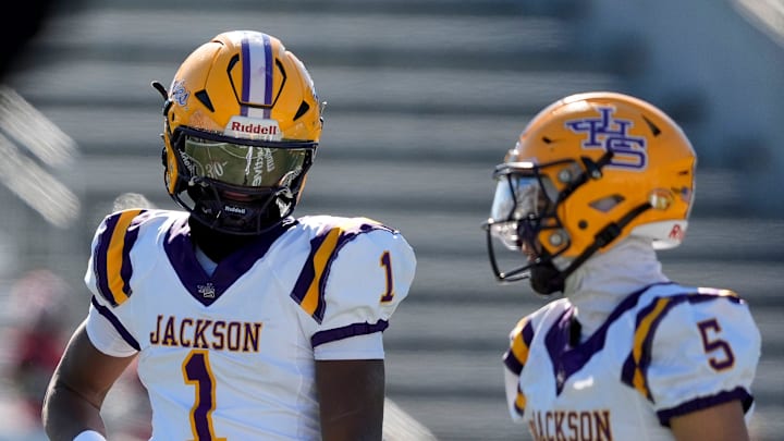 Dec 6, 2024; Birmingham, AL, USA; Jackson's Landon Duckworth (1) and Jackson's Chris Payne (5) talk during a timeout during the game with Cherokee County at Protective Stadium in the AHSAA 4A State Championship game.