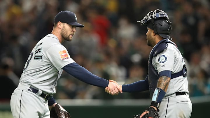 Seattle Mariners pitcher Hunter Strickland (43) and catcher Omar Narvaez (22) shake hands after the game against the Oakland Athletics at Tokyo Dome in 2019. Seattle Mariners pitcher Hunter Strickland (43) and catcher Omar Narvaez (22) shake hands after the game against the Oakland Athletics at Tokyo Dome in 2019.