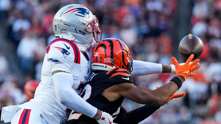 Nov 23, 2025; Cincinnati, Ohio, USA; New England Patriots cornerback Carlton Davis III (7) breaks up a pass to Cincinnati Bengals wide receiver Mitchell Tinsley (82) in the fourth quarter at Paycor Stadium. Mandatory Credit: Sam Greene-USA TODAY Network via Imagn Images Nov 23, 2025; Cincinnati, Ohio, USA; New England Patriots cornerback Carlton Davis III (7) breaks up a pass to Cincinnati Bengals wide receiver Mitchell Tinsley (82) in the fourth quarter at Paycor Stadium. Mandatory Credit: Sam Greene-USA TODAY Network via Imagn Images