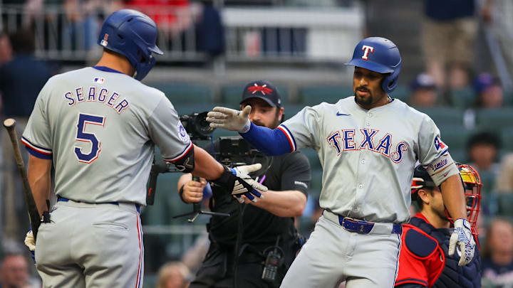 Texas Rangers second base Marcus Semien (2) celebrates after a home run with shortstop Corey Seager (5). Mandatory Credit: Brett Davis-USA TODAY Sports