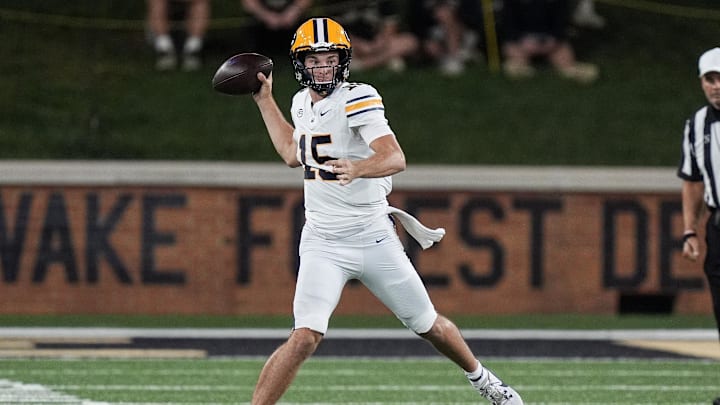 Nov 8, 2024; Winston-Salem, North Carolina, USA; California Golden Bears quarterback Fernando Mendoza (15) throws against the Wake Forest Demon Deacons during the first half at Allegacy Federal Credit Union Stadium. Mandatory Credit: Jim Dedmon-Imagn Images