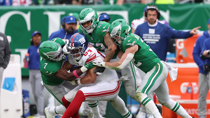 Oct 26, 2025; Philadelphia, Pennsylvania, USA; Philadelphia Eagles cornerback Kelee Ringo (7) and linebacker Zack Baun (53) and safety Reed Blankenship (32) tackle New York Giants tight end Theo Johnson (84) in the third quarter at Lincoln Financial Field. Oct 26, 2025; Philadelphia, Pennsylvania, USA; Philadelphia Eagles cornerback Kelee Ringo (7) and linebacker Zack Baun (53) and safety Reed Blankenship (32) tackle New York Giants tight end Theo Johnson (84) in the third quarter at Lincoln Financial Field.