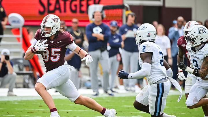 Sep 12, 2026; Blacksburg, Virginia, USA; Virginia Tech Hokies tight end Luke Reynolds (85) runs with the ball as Old Dominion Monarchs safety Daevon Iles (2) pursues during the second quarter at Lane Stadium. Mandatory Credit: Brian Bishop-Imagn Images Sep 12, 2026; Blacksburg, Virginia, USA; Virginia Tech Hokies tight end Luke Reynolds (85) runs with the ball as Old Dominion Monarchs safety Daevon Iles (2) pursues during the second quarter at Lane Stadium. Mandatory Credit: Brian Bishop-Imagn Images