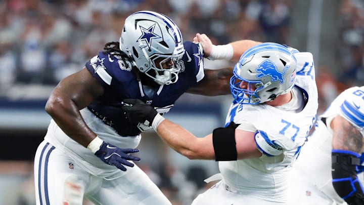 Oct 13, 2024; Arlington, Texas, USA;  Dallas Cowboys defensive tackle Mazi Smith (58) and Detroit Lions center Frank Ragnow (77) battle during the second quarter at AT&T Stadium. Mandatory Credit: Kevin Jairaj-Imagn Images