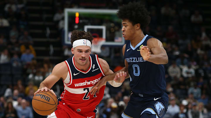 Nov 8, 2024; Memphis, Tennessee, USA; Washington Wizards forward Corey Kispert (24) drives against Memphis Grizzlies forward Jaylen Wells (0) during the first half at FedExForum. Mandatory Credit: Petre Thomas-Imagn Images
