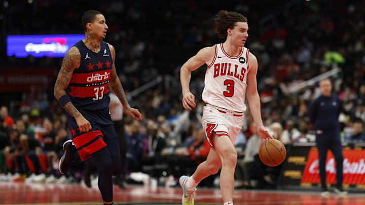 Nov 26, 2024; Washington, District of Columbia, USA; Chicago Bulls guard Josh Giddey (3) drives to the basket as Washington Wizards forward Kyle Kuzma (33) chases in the third quarter at Capital One Arena. Mandatory Credit: Geoff Burke-Imagn Images