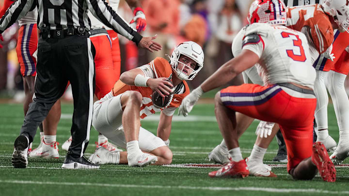 Dec 21, 2024; Austin, Texas, USA; Texas Longhorns quarterback Arch Manning (16) looks up after recovering a fumble against the Clemson Tigers in the second half at Darrell K Royal Texas Memorial Stadium. Mandatory Credit: Ricardo B. Brazziell/USA Today Network via Imagn Images Dec 21, 2024; Austin, Texas, USA; Texas Longhorns quarterback Arch Manning (16) looks up after recovering a fumble against the Clemson Tigers in the second half at Darrell K Royal Texas Memorial Stadium. Mandatory Credit: Ricardo B. Brazziell/USA Today Network via Imagn Images