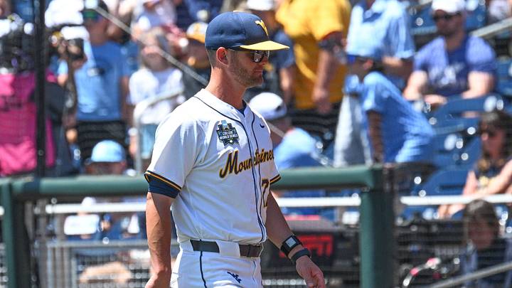 Jun 17, 2026; Omaha, NE, USA;  West Virginia Mountaineers head coach Steve Sabins walks to the dugout before the game against the North Carolina Tar Heels at Charles Schwab Field. Mandatory Credit: Steven Branscombe-Imagn Images