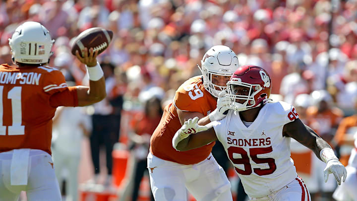 Oklahoma's Isaiah Thomas (95) goes past Texas' Andrej Karic (69) as Casey Thompson (11) throws a pass during the Red River Showdown college football game between the University of Oklahoma Sooners (OU) and the University of Texas (UT) Longhorns at the Cotton Bowl in Dallas, Saturday, Oct. 9, 2021. Oklahoma won 55-48.
Ou Vs Texas Oklahoma's Isaiah Thomas (95) goes past Texas' Andrej Karic (69) as Casey Thompson (11) throws a pass during the Red River Showdown college football game between the University of Oklahoma Sooners (OU) and the University of Texas (UT) Longhorns at the Cotton Bowl in Dallas, Saturday, Oct. 9, 2021. Oklahoma won 55-48.
Ou Vs Texas