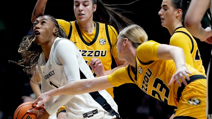 Vanderbilt guard Mikayla Blakes (1) drives to the basket as Missouri guard Abbey Schreacke (23) reaches in during the second half of an NCAA college basketball game at Memorial Gymnasium Thursday, Jan. 8, 2026, in Nashville, Tenn. Vanderbilt won 99-68.