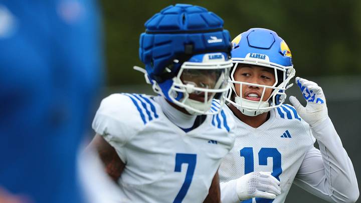 Kansas redshirt junior linebacker Quincy Davis (13) runs to the next drill alongside redshirt senior linebacker Bam Crouch (7) during practice at The University of Kansas on Aug. 6, 2026. Kansas redshirt junior linebacker Quincy Davis (13) runs to the next drill alongside redshirt senior linebacker Bam Crouch (7) during practice at The University of Kansas on Aug. 6, 2026.