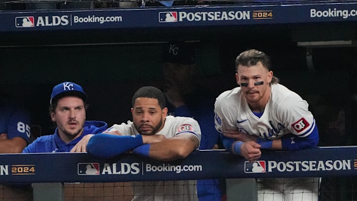 Oct 10, 2024; Kansas City, Missouri, USA; Kansas City Royals first baseman Vinnie Pasquantino (9), outfielder Tommy Pham (22) and shortstop Bobby Witt Jr. (7) watch play from the dugout during the seventh inning against the New York Yankees during game four of the ALDS for the 2024 MLB Playoffs at Kauffman Stadium. Mandatory Credit: Denny Medley-Imagn Images