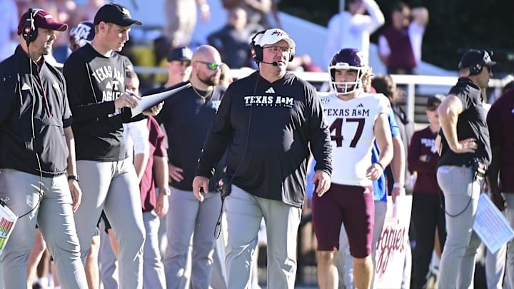 Oct 19, 2024; Starkville, Mississippi, USA; Texas A&M Aggies head coach Mike Elko walks down the sideline during the first half against the Mississippi State Bulldogs at Davis Wade Stadium at Scott Field. Mandatory Credit: Matt Bush-Imagn Images